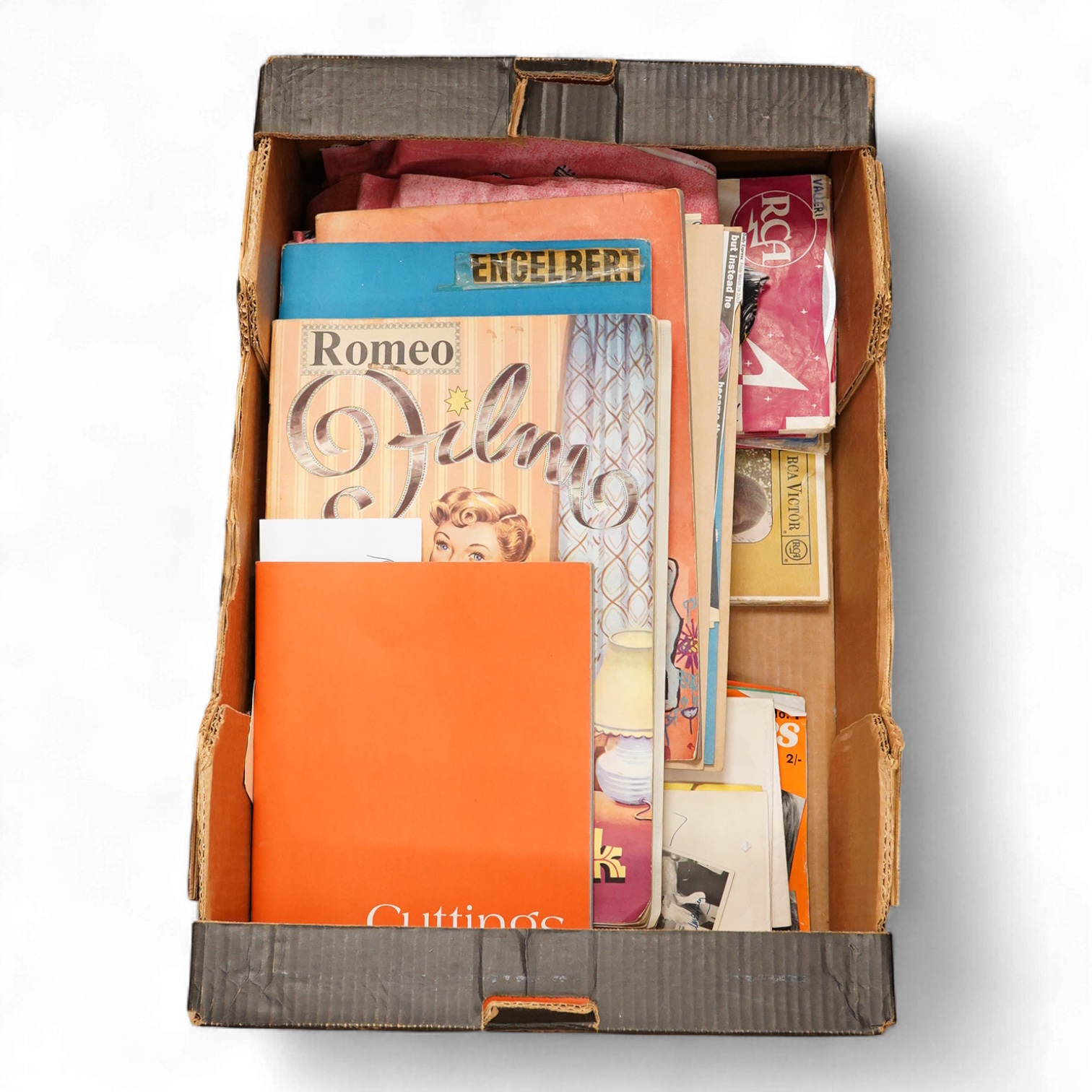 A collection of original 1960s pop memorabilia including The Beatles related items; a pair of Beatles curtains together with some spare material, a brooch on its original backing card, and a number of magazines, a 1979 W